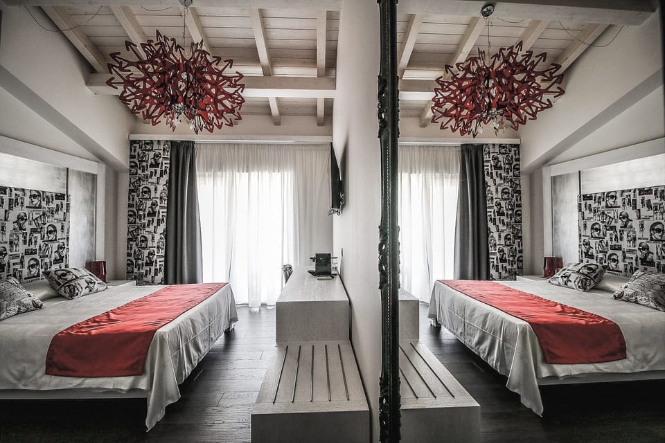 Deluxe Room, Pool View | In-room safe, desk, laptop workspace, soundproofing