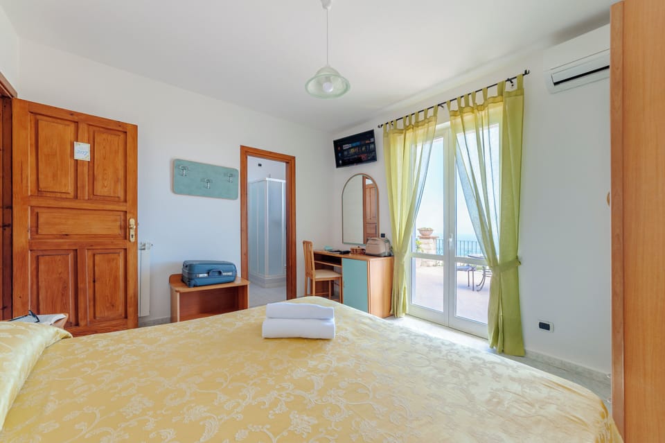 Double or Twin Room, Sea View | In-room safe, desk, free WiFi, bed sheets