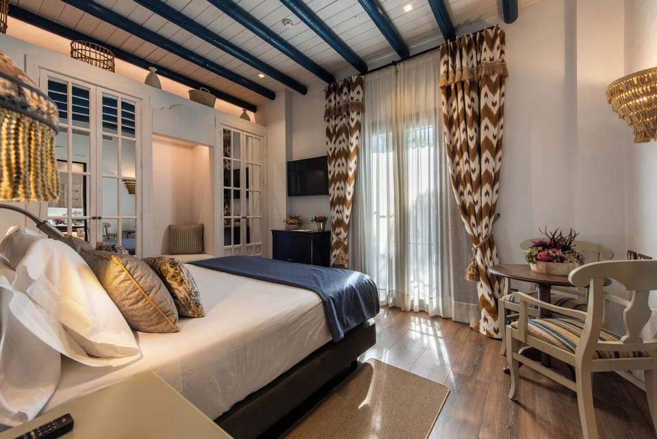 Deluxe Double Room | Minibar, in-room safe, individually decorated, desk