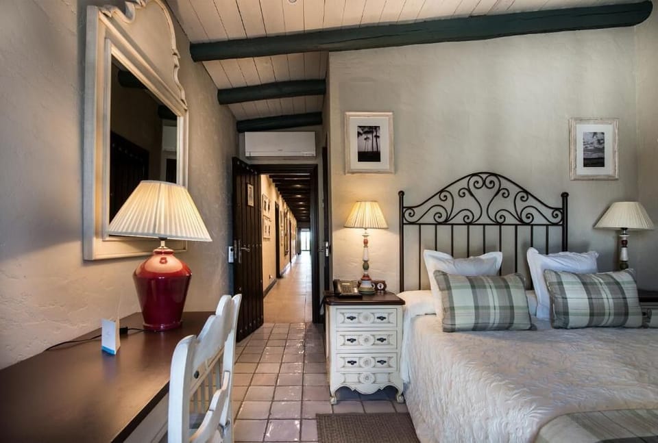 Single Room | Minibar, in-room safe, individually decorated, desk