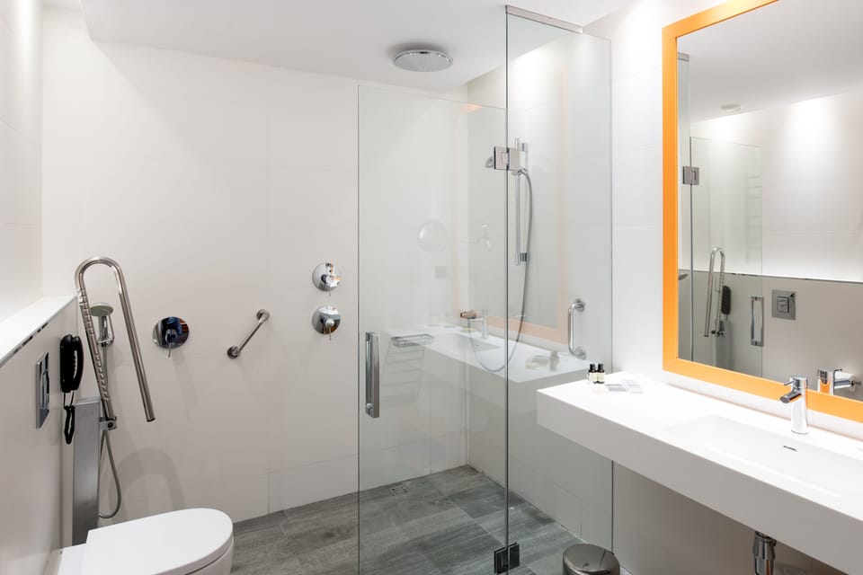 Shower, eco-friendly toiletries, hair dryer, towels