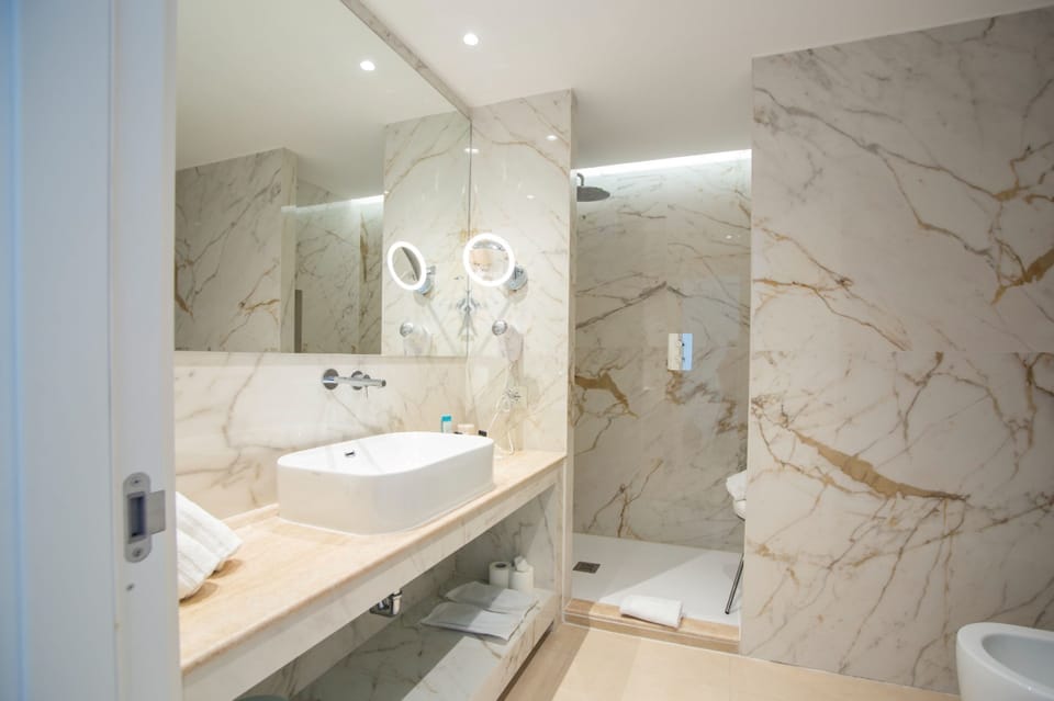 Premium Double Room, Patio, Pool View | Bathroom | Shower, rainfall showerhead, hair dryer, slippers