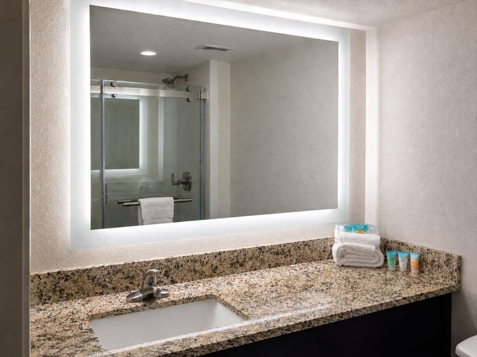 Designer toiletries, hair dryer, towels, soap