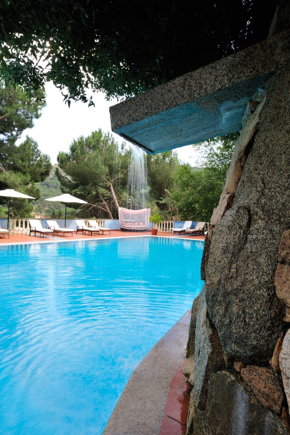 Seasonal outdoor pool, open 10:00 AM to 7:00 PM, pool umbrellas
