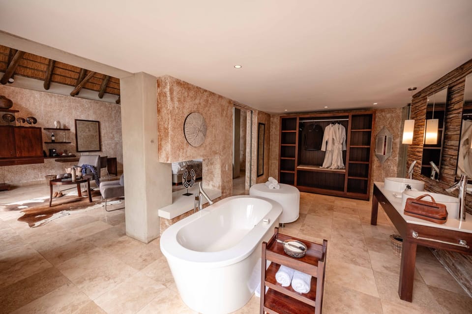 Deep soaking tub, designer toiletries, hair dryer, towels