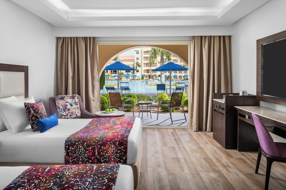Deluxe Double Pool View Room | Hypo-allergenic bedding, minibar, in-room safe, desk