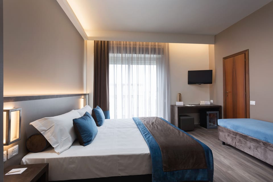 Deluxe Triple Room | Hypo-allergenic bedding, down comforters, minibar, in-room safe