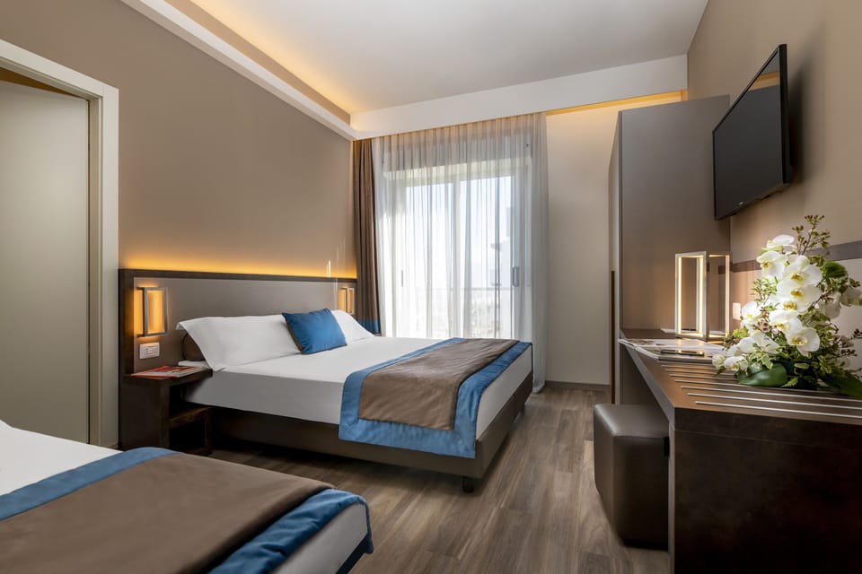 Deluxe Triple Room | Hypo-allergenic bedding, down comforters, minibar, in-room safe