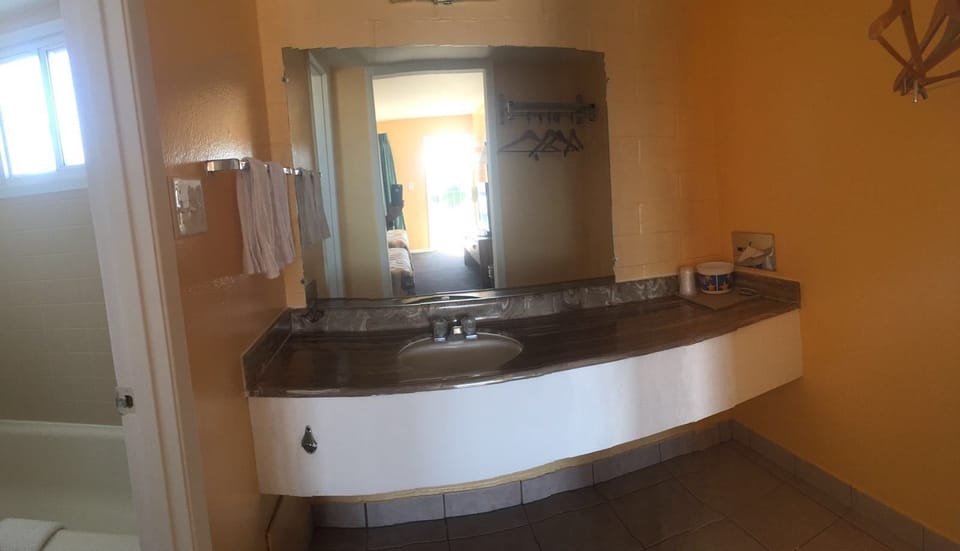 Room, Multiple Beds (3 Queen Beds) | Bathroom sink