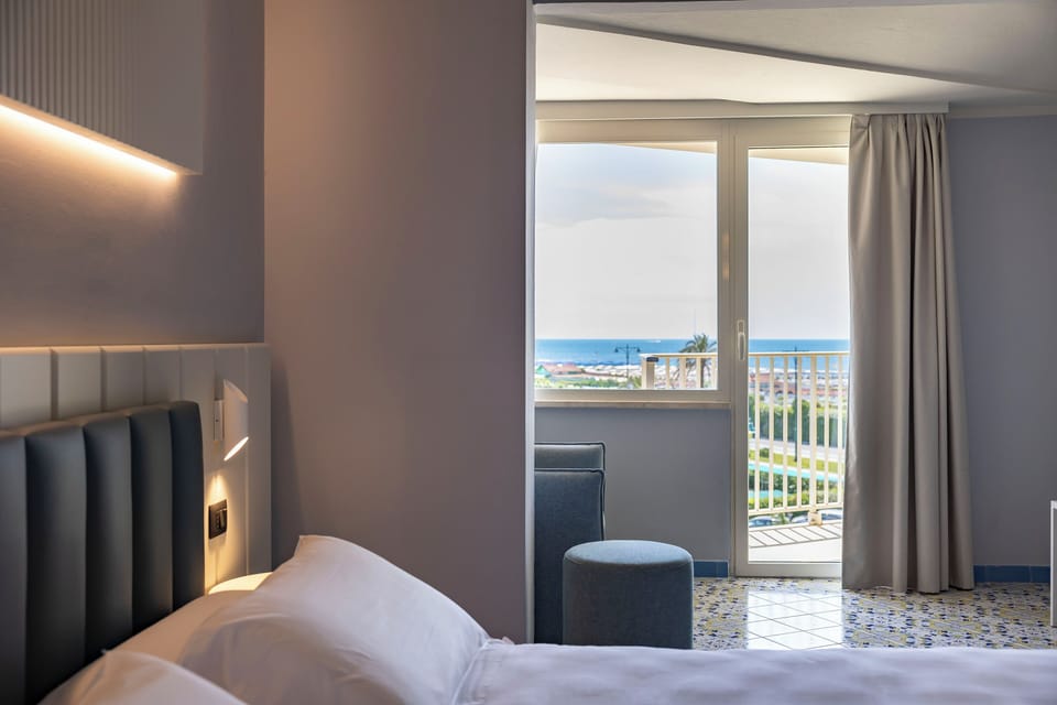 Deluxe Double or Twin Room, Sea View | Minibar, in-room safe, desk, free WiFi