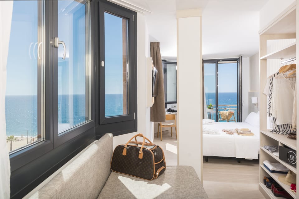 Grand Triple Room, Balcony, Sea View | In-room safe, desk, blackout drapes, soundproofing