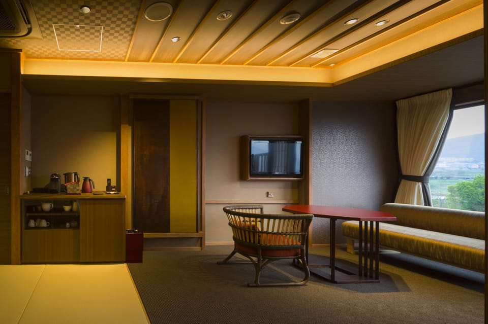 Mizuho Western Room with Open Air Bath, Mt. Fuji View [With Yamanshi Wine Lounge Access] | Living room | Flat-screen TV