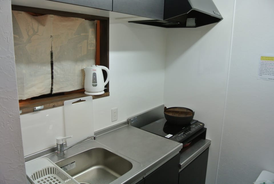 Full-size fridge, microwave, stovetop, cookware/dishes/utensils