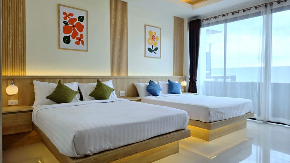 Family Room With Balcony | In-room safe, blackout drapes, free WiFi, bed sheets