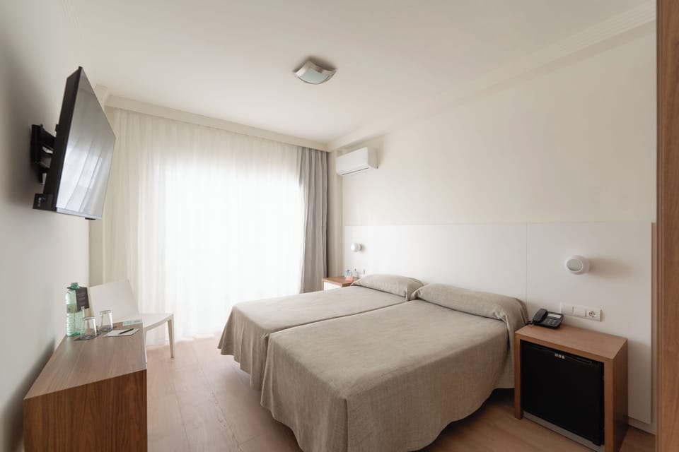 Minibar, desk, blackout drapes, iron/ironing board