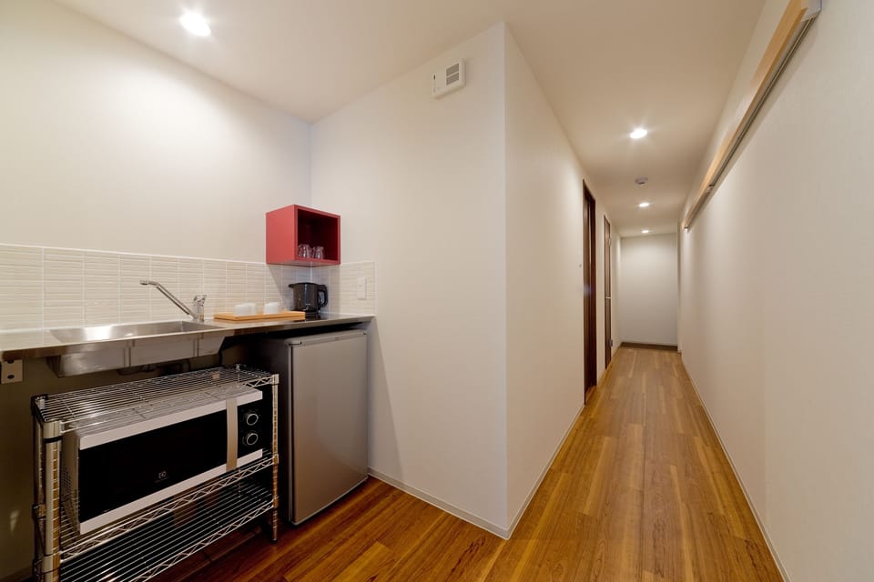 Deluxe Twin Room with Tatami Area | Private kitchen | Fridge, microwave