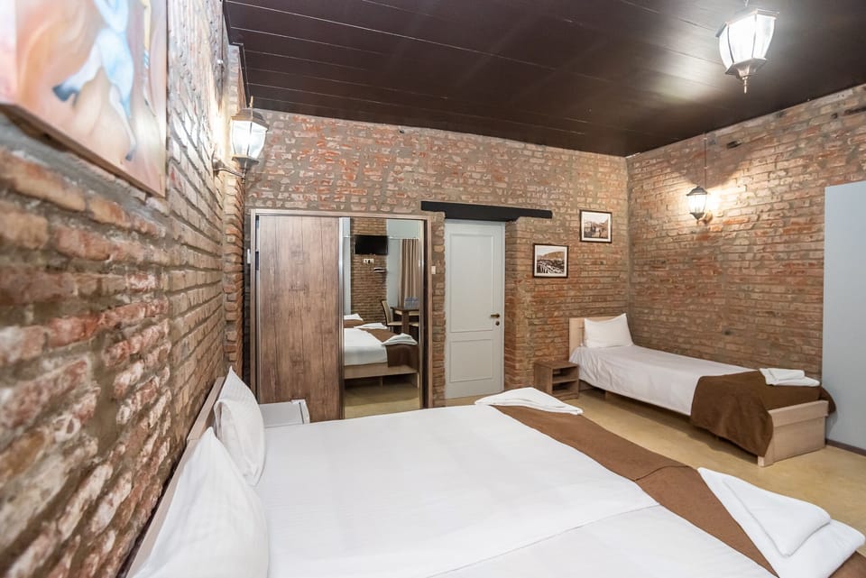 Family Room | Hypo-allergenic bedding, minibar, in-room safe, desk