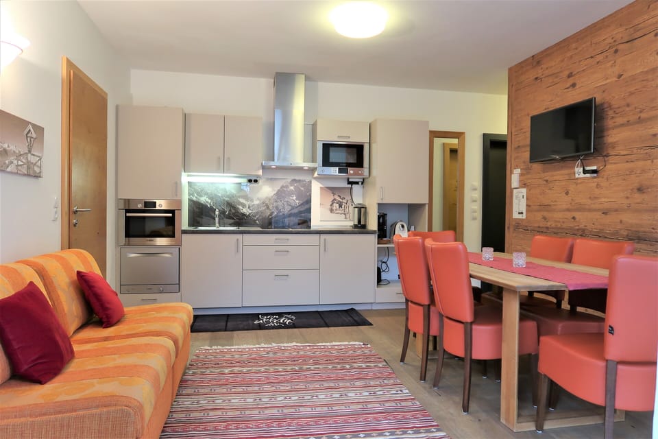 Comfort Apartment, 3 Bedrooms, Sauna, Ground Floor | Living area | Flat-screen TV, heated floors