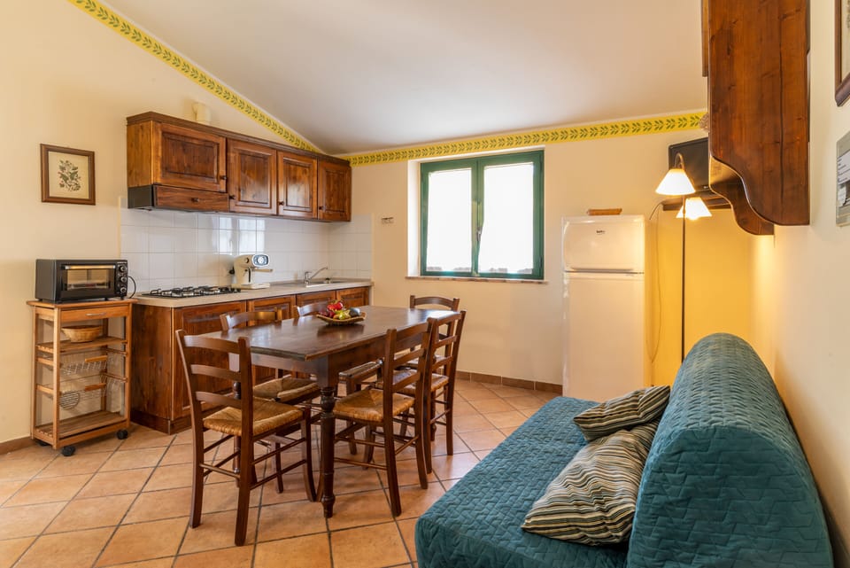 Apartment, 2 Bedrooms (Olivo B) | Living area | Flat-screen TV