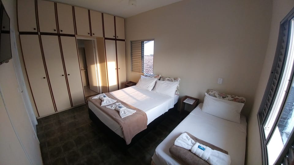 Triple Room | Minibar, blackout drapes, free WiFi, bed sheets