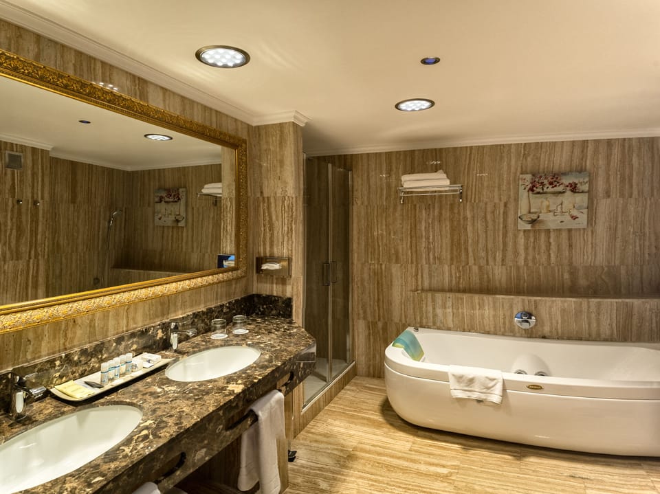 Junior Suite, Balcony, Sea View | Bathroom | Hair dryer, towels, soap, shampoo
