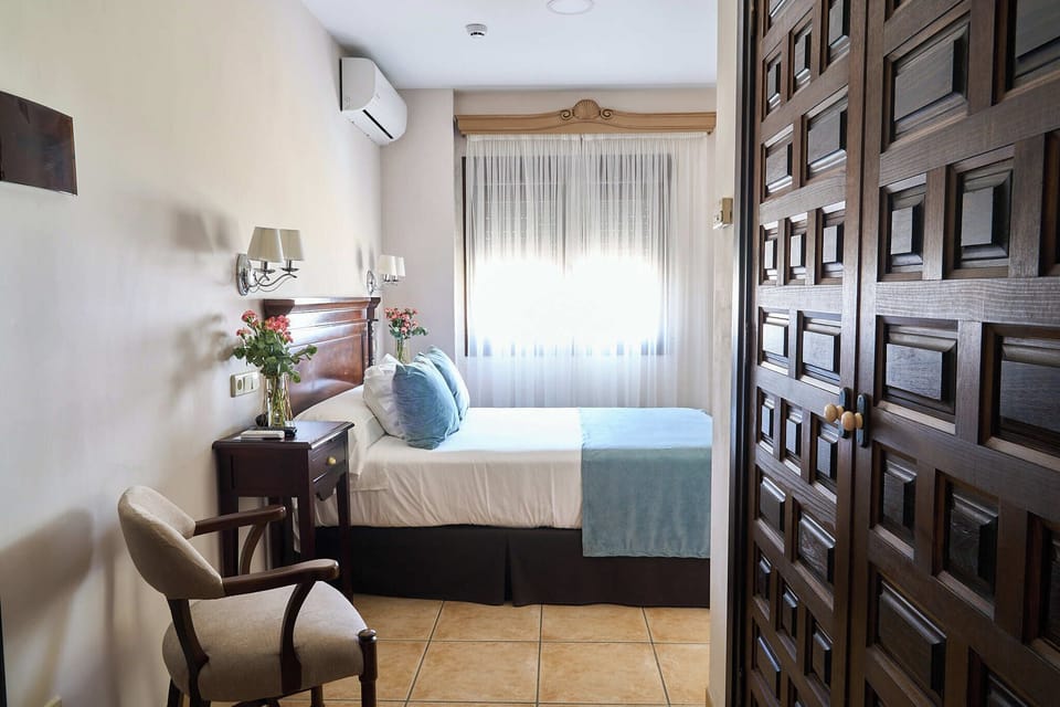 Single Room | Minibar, in-room safe, individually decorated, desk