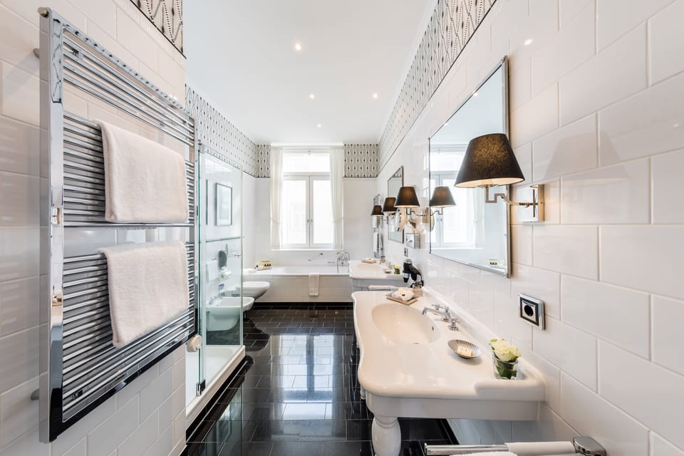 Separate tub and shower, rainfall showerhead, designer toiletries