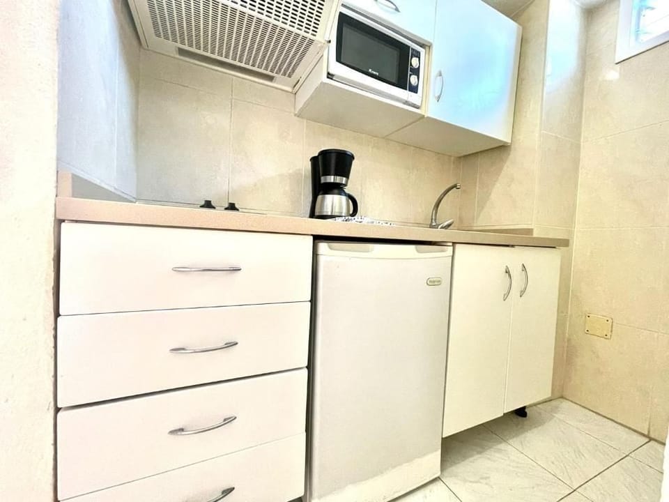 Fridge, microwave, electric kettle, cookware/dishes/utensils