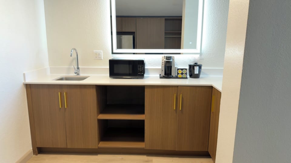 Desk, laptop workspace, blackout drapes, iron/ironing board