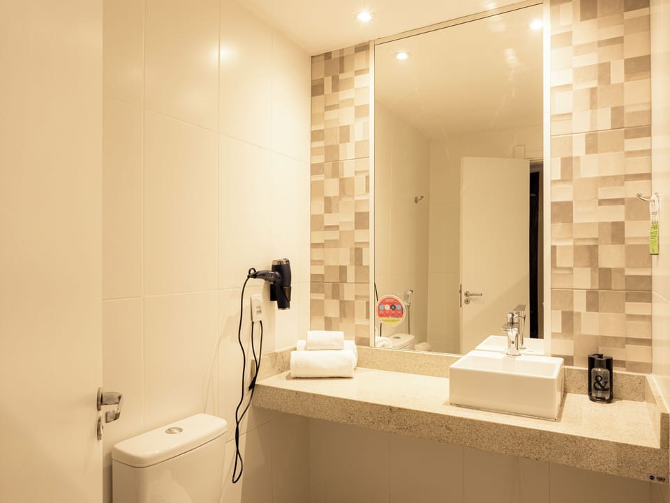 Shower, rainfall showerhead, designer toiletries, hair dryer