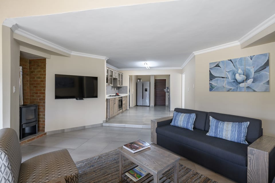 Four Bedroom Villa with Splash pool | Living room | 42-inch flat-screen TV with satellite channels, TV