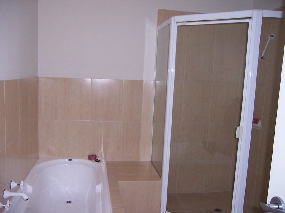 Shower, hair dryer, towels, shampoo