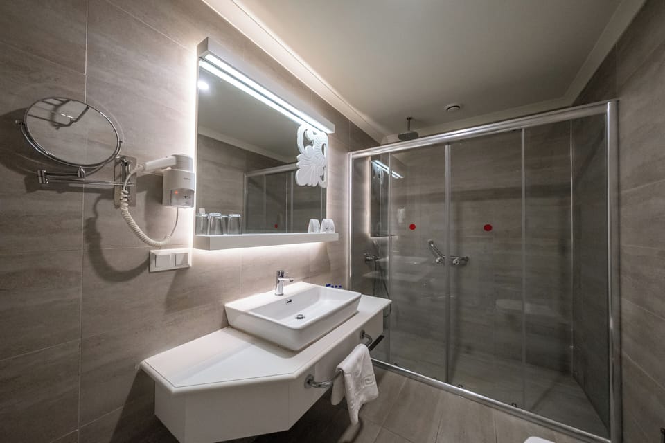 Shower, free toiletries, hair dryer, slippers