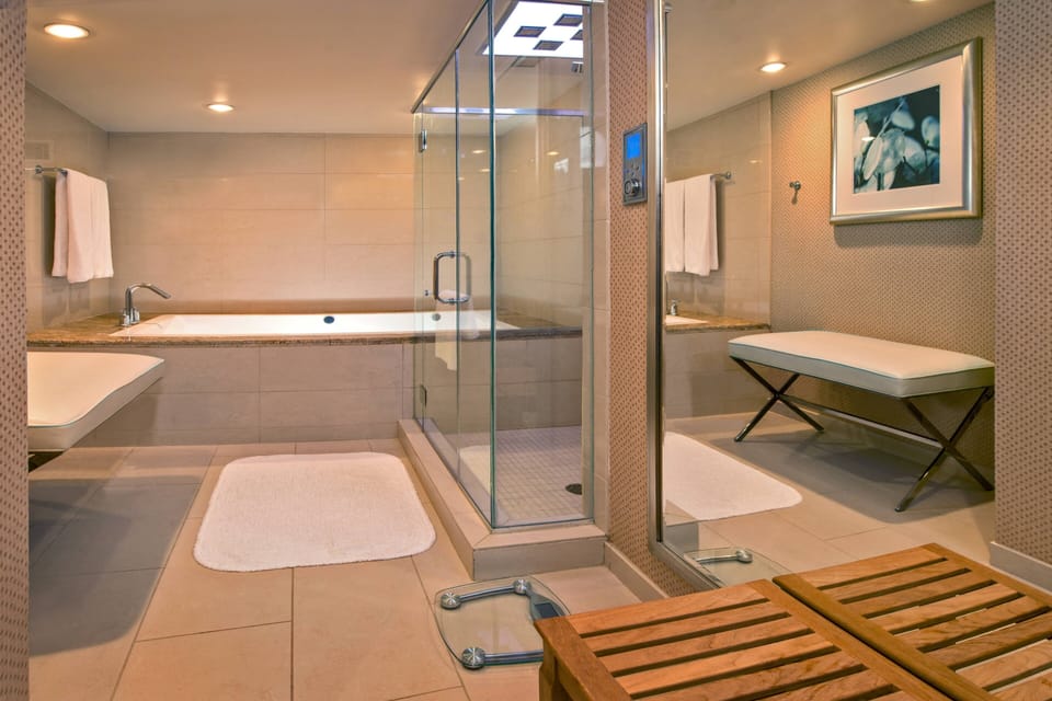 Combined shower/tub, designer toiletries, hair dryer, bathrobes