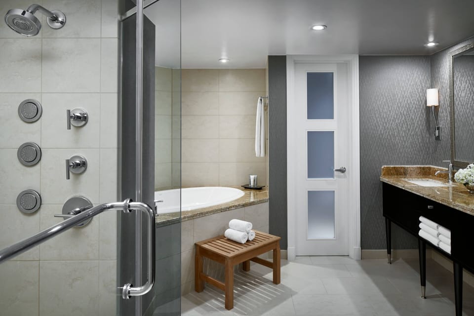 Combined shower/tub, designer toiletries, hair dryer, bathrobes