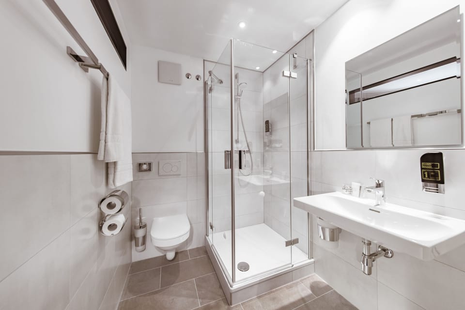 Shower, free toiletries, hair dryer, towels