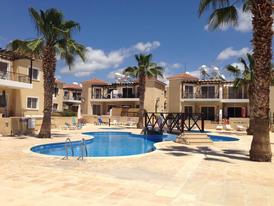 Outdoor pool, open 8:00 AM to 8:00 PM, pool umbrellas, sun loungers