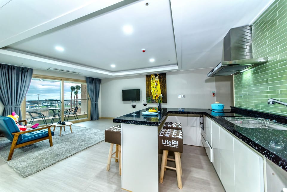 Family Room (Luxury A) | Private kitchen | Fridge, electric kettle