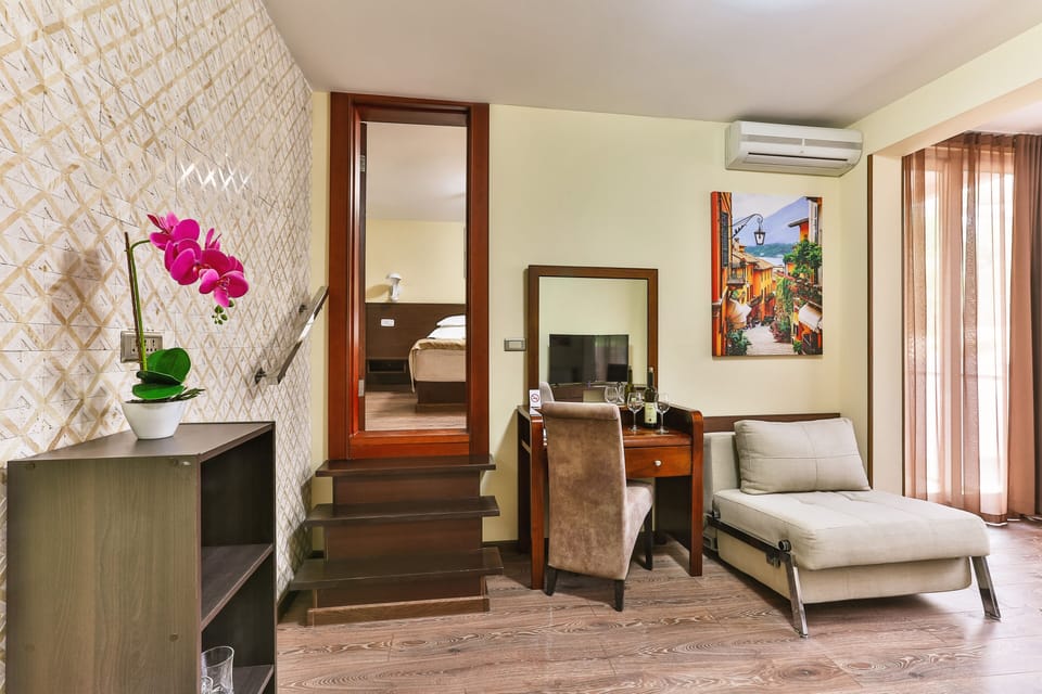 Family Suite, 2 Bedrooms | Minibar, in-room safe, soundproofing, iron/ironing board
