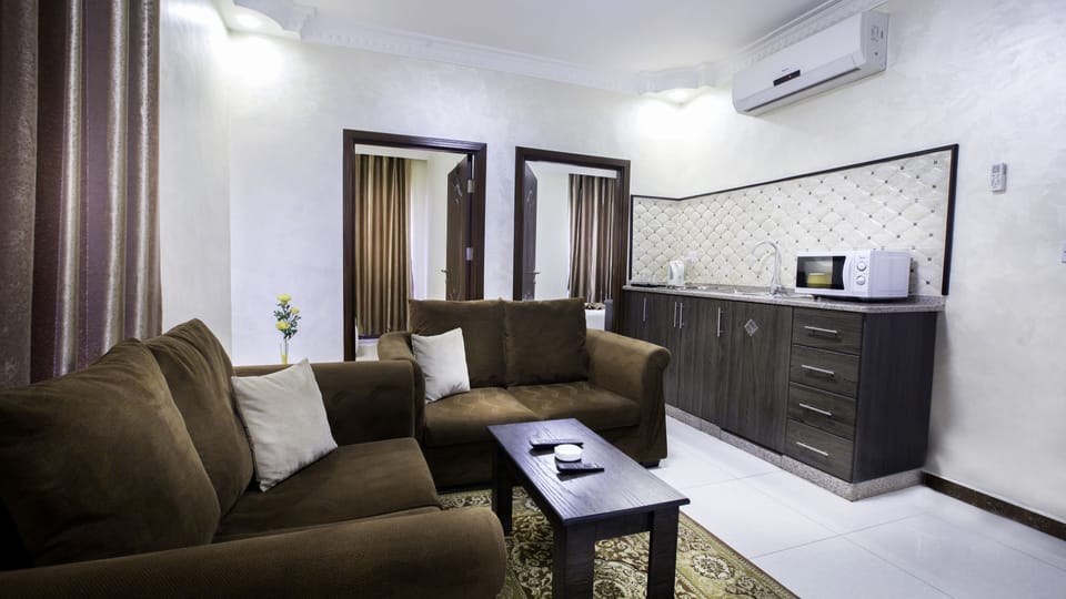 Family Suite | Minibar, in-room safe, desk, iron/ironing board (on request)