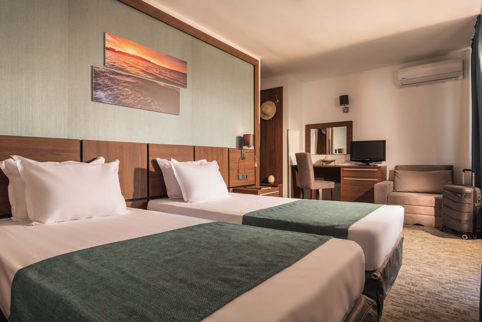 Double or Twin Room, Balcony | Laptop workspace, blackout drapes, free WiFi, bed sheets