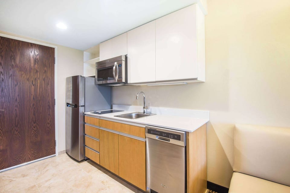 Fridge, microwave, coffee/tea maker, cookware/dishes/utensils