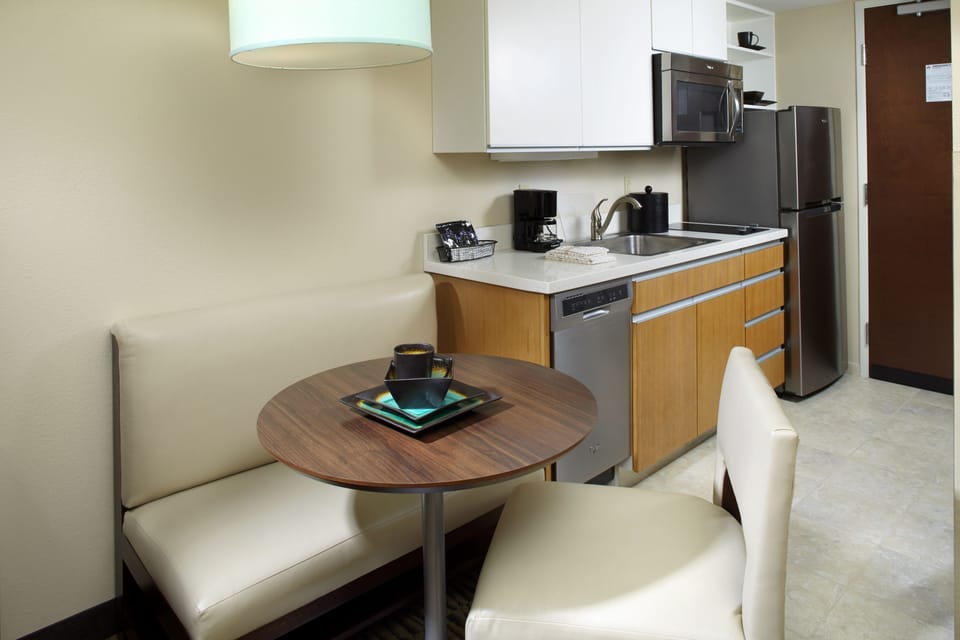 Fridge, microwave, coffee/tea maker, cookware/dishes/utensils