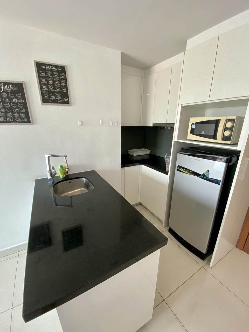 Condo, 1 Bedroom | Private kitchen | Fridge, microwave, electric kettle, dining tables