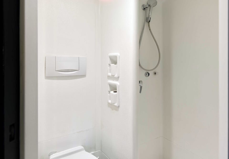 Shower, eco-friendly toiletries, hair dryer, towels