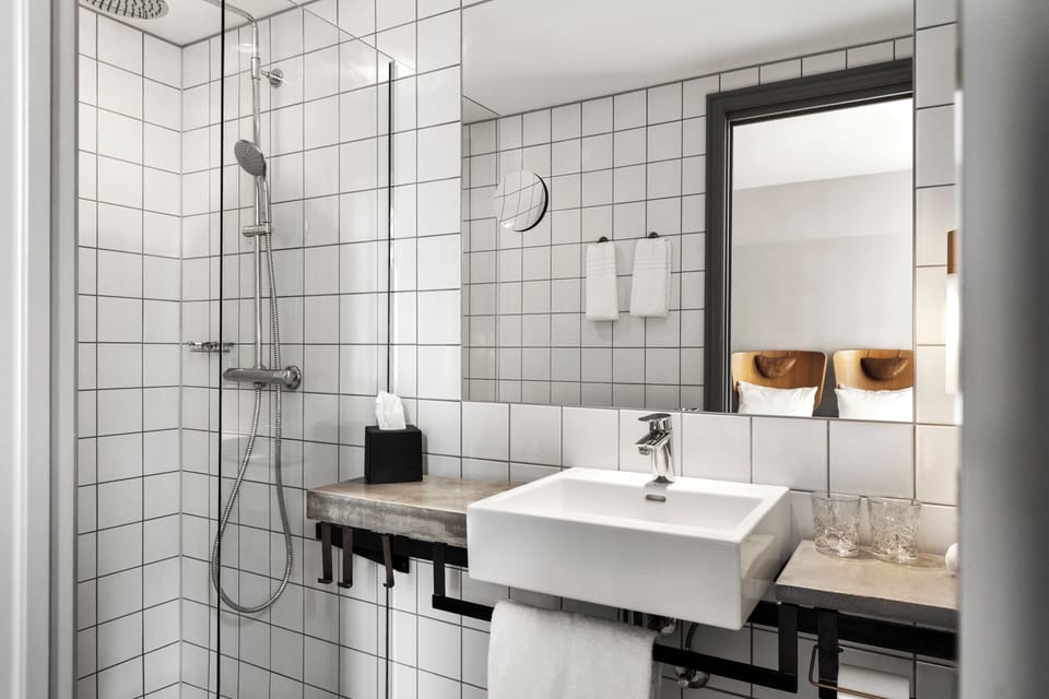 Deluxe Double | Bathroom | Designer toiletries, hair dryer, towels, soap