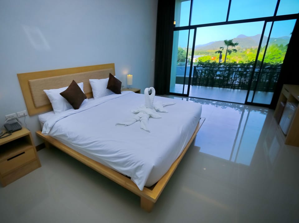 Deluxe Room, Pool Access | In-room safe, desk, laptop workspace, individually decorated