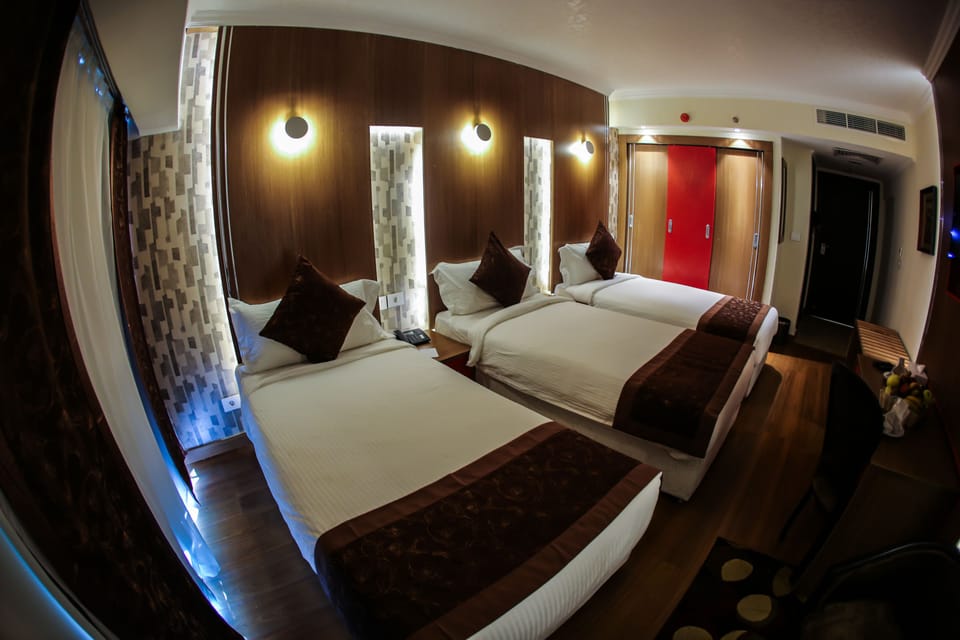 Triple Room, City View | Minibar, in-room safe, rollaway beds, free WiFi