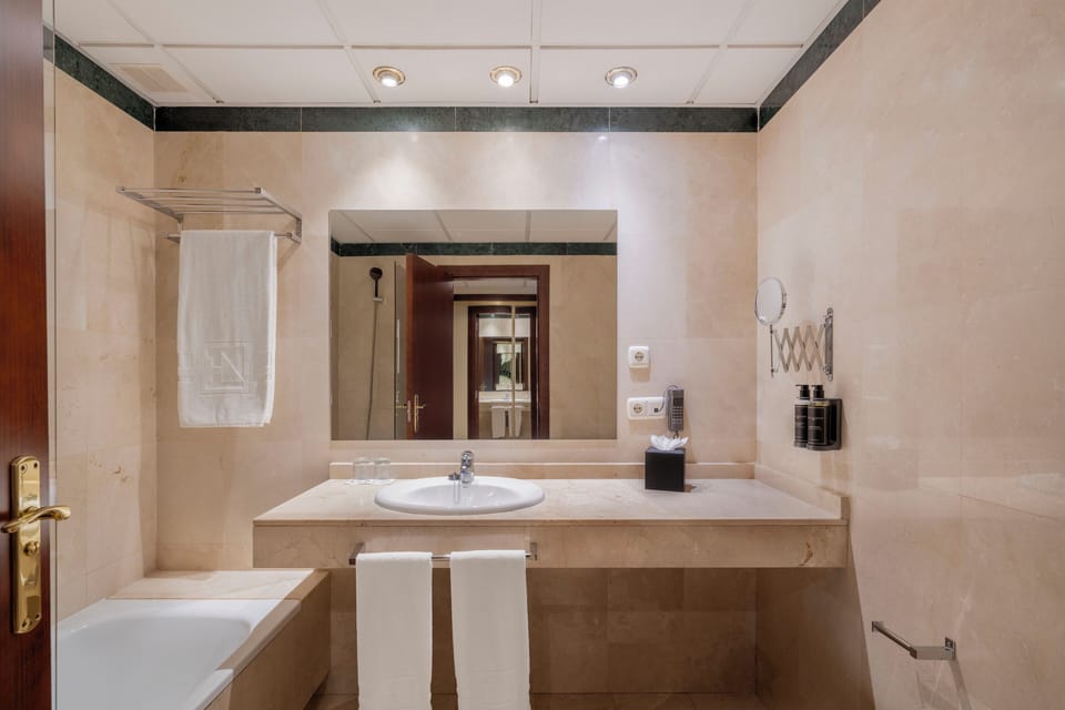 Shower, eco-friendly toiletries, hair dryer, towels
