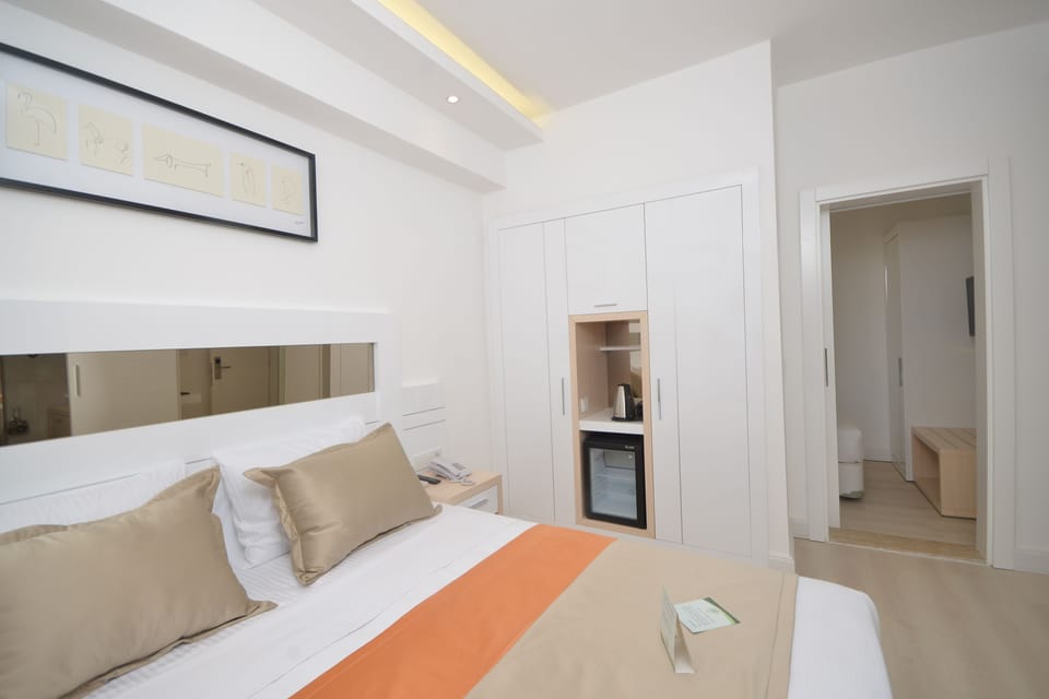 Suite, 2 Bedrooms | Minibar, in-room safe, soundproofing, travel crib